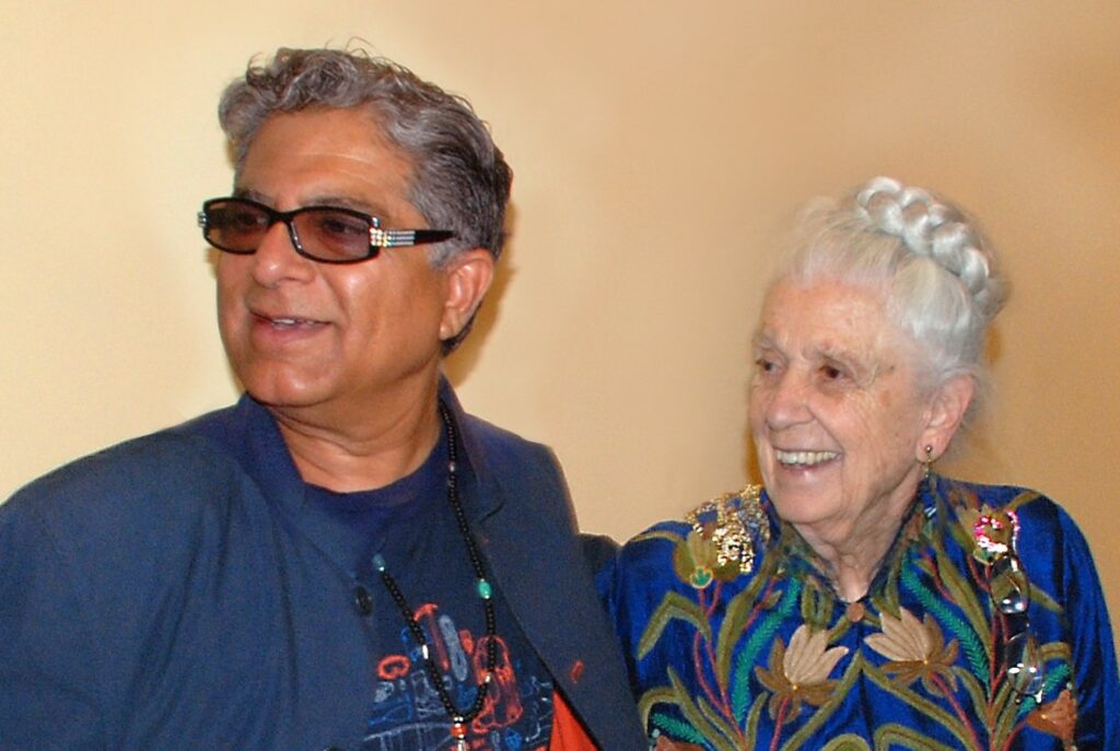 Dr. Gladys and Dr. Deepak Chopra discuss health at a conference.